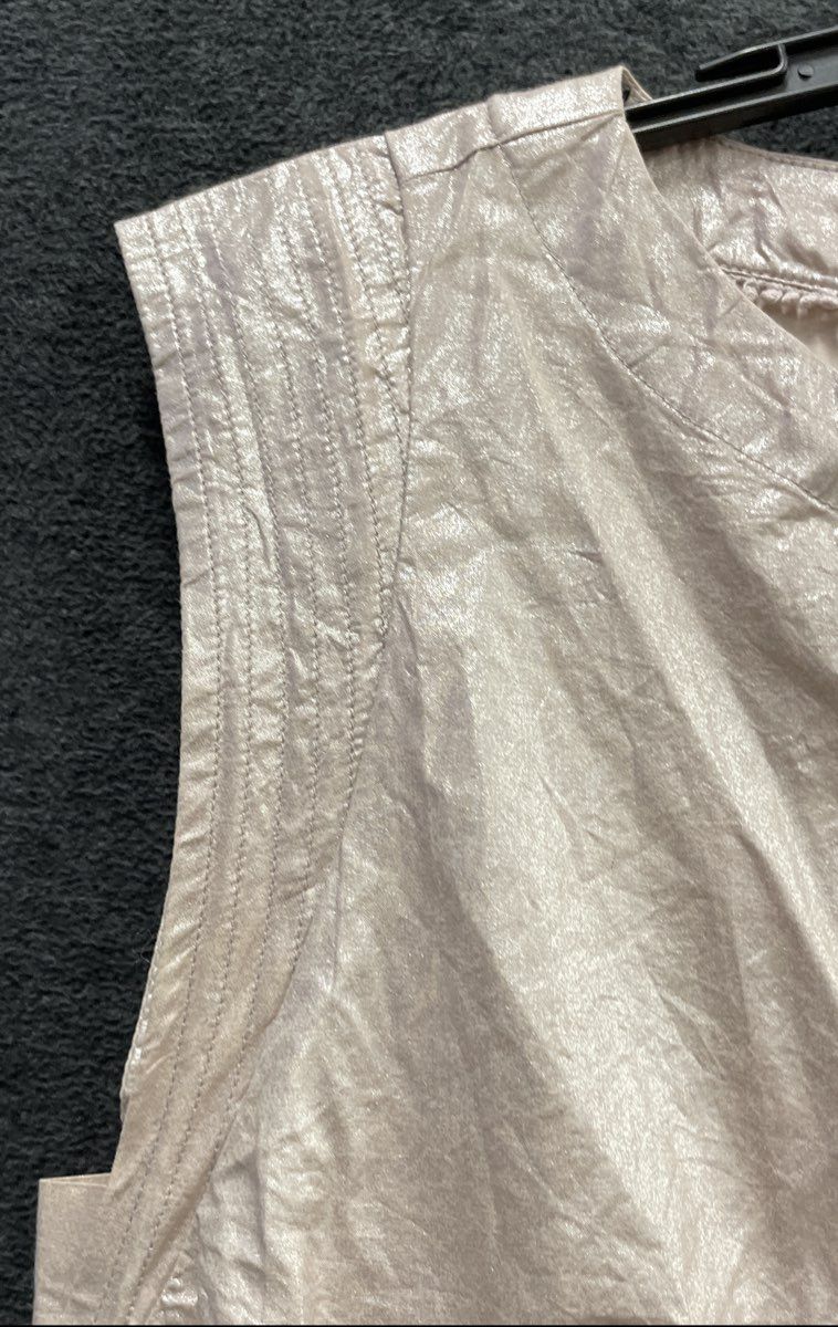 Anthropologie Women's Metallic Champagne Peplum Sleeveless Blouse Pom Pom Sz S