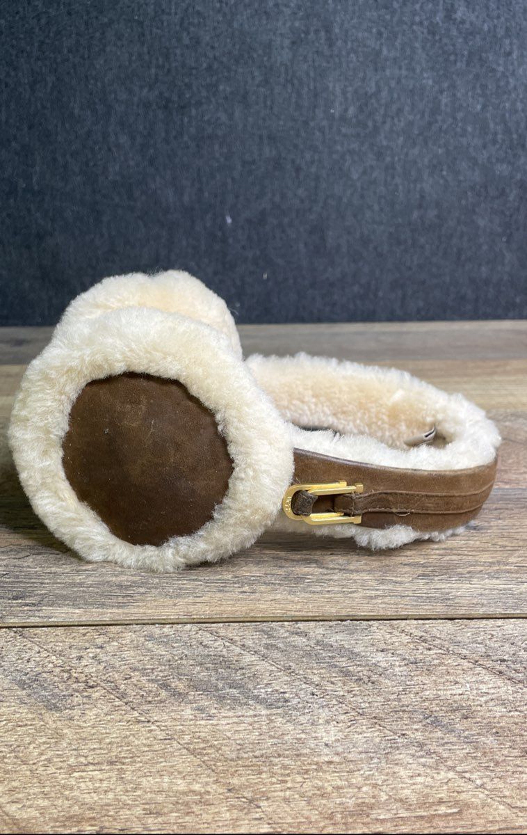UGG Women's Brown Sheepskin Shearling Earmuffs Cream Fleece Gold Tone Logo