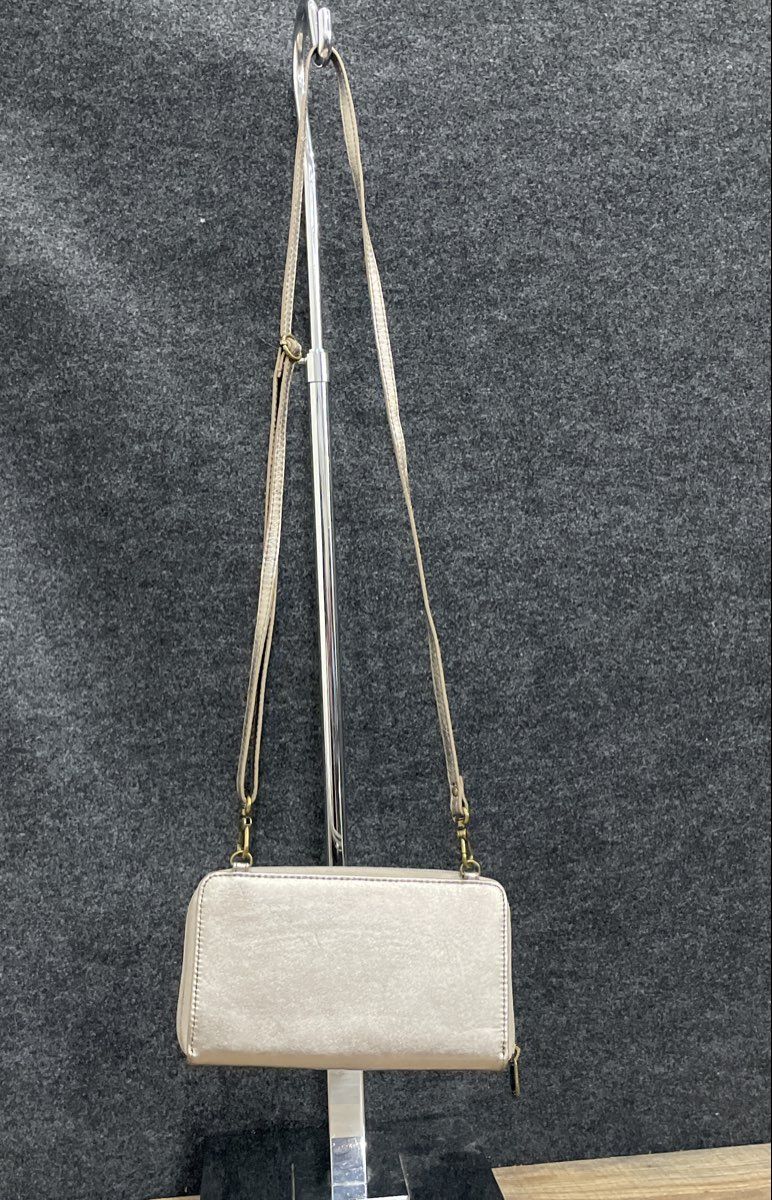 The Sak Silver Metallic Leather Crossbody Wallet on a String Mini Purse