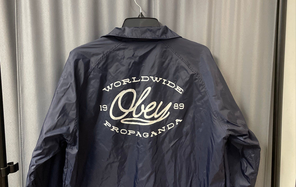 Obey Men's Navy Blue Nylon Coach's Jacket Worldwide Propaganda Graphic Sz L
