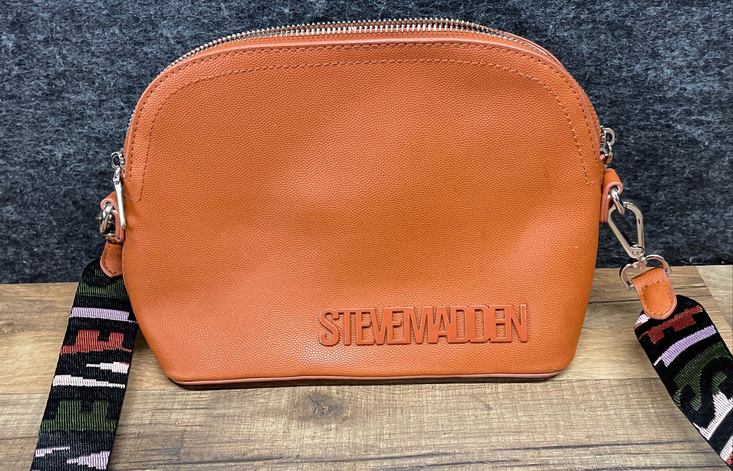 Steve Madden Brown Grained Leather Dome Crossbody Bag Wide Logo Guitar Strap