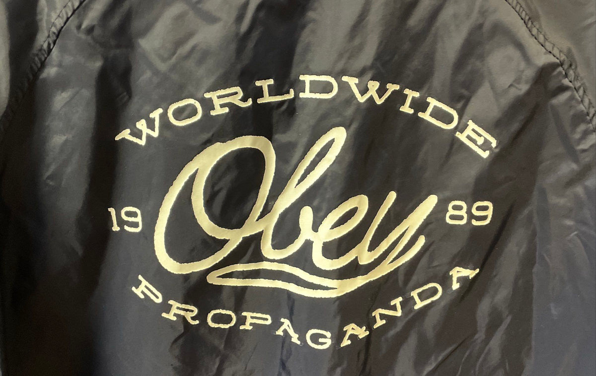 Obey Men's Navy Blue Nylon Coach's Jacket Worldwide Propaganda Graphic Sz L