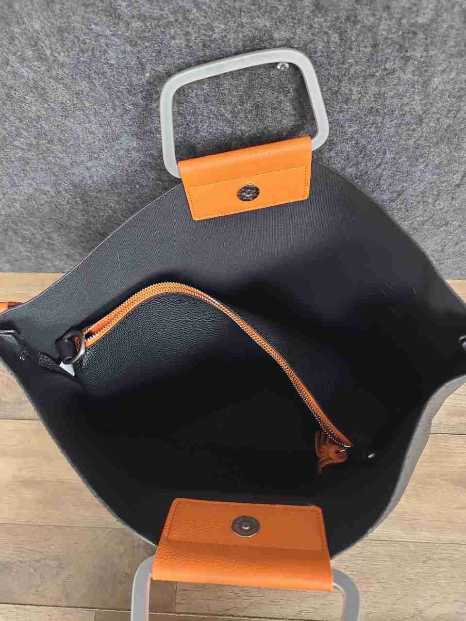 Cirque du Soleil Black Pebbled Tote Bag Orange Accents Chevron Crossbody Strap